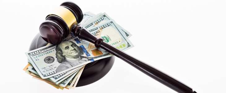 A gavel with money