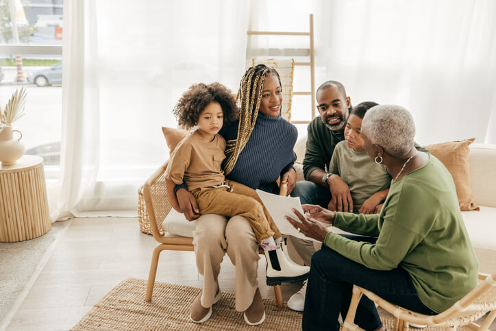 Family sitting together in living room