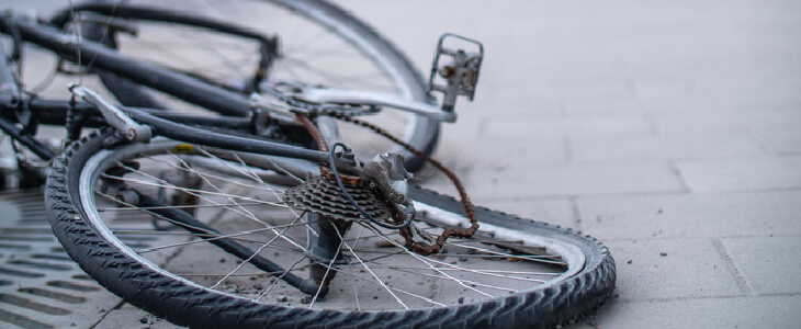 bicycle with a bent wheel, laid on the ground