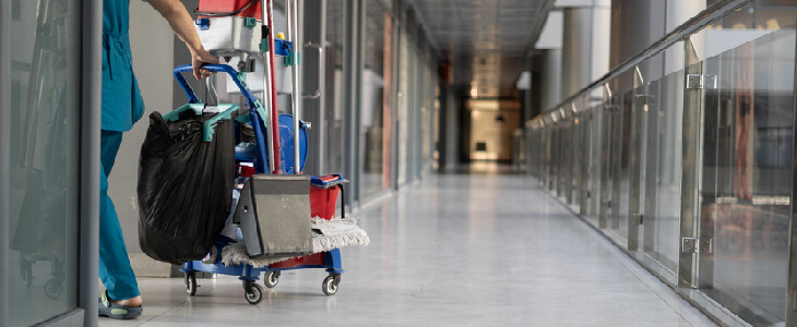 Janitor leaving the scene of a liquid spill