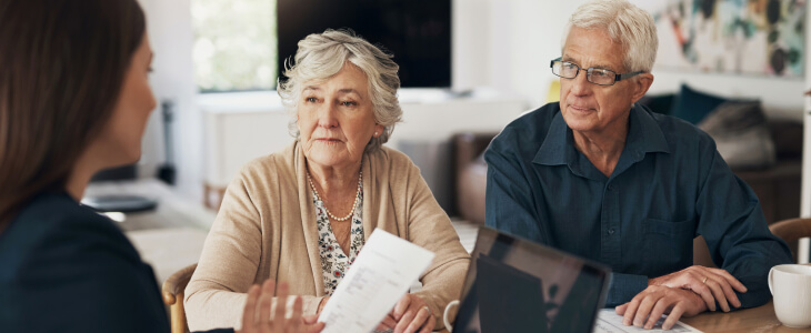 A real estate lawyer talks to an older couple