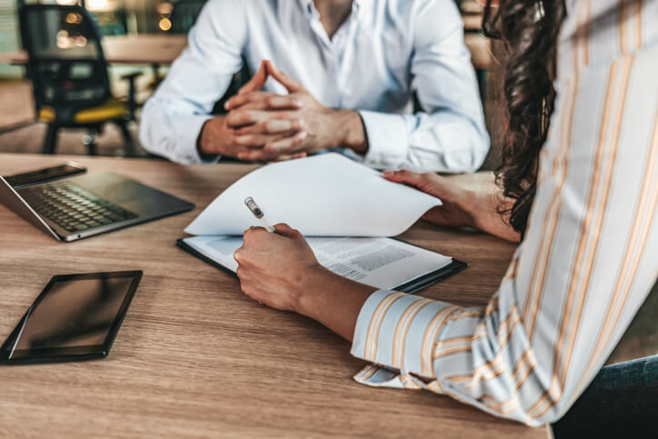 Estate planning attorney sitting with client