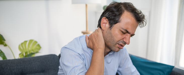 Man suffering from neck pain due to a whiplash injury
