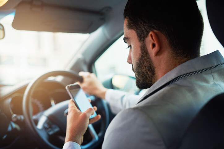 Man texting while driving